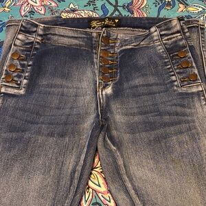 Mid Rise Blue skinny Jeans with Button Accents long legs